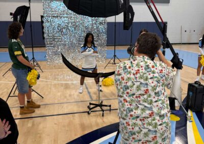 Tom Uchida photographing cheerleaders at Lawson High School