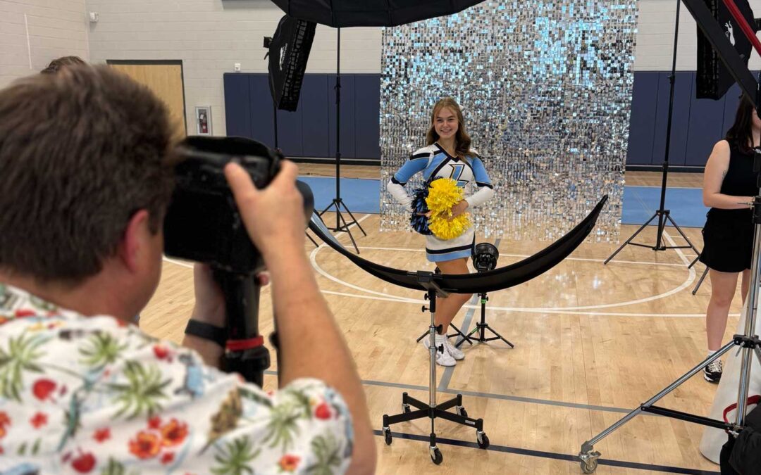 Tom Uchida photographing cheerleaders at Lawson High School